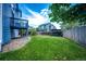 Beautiful backyard with a lush lawn, pergola with seating area, and gravel area near the house at 8930 Apache Plume Dr, Parker, CO 80134