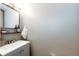 Clean bathroom with modern fixtures, a sleek mirror, and a well-maintained sink at 8930 Apache Plume Dr, Parker, CO 80134