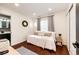 Well-lit bedroom features hardwood floors and a neutral color scheme at 8930 Apache Plume Dr, Parker, CO 80134