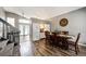 Open-concept dining room featuring hardwood floors and a view of the staircase at 8930 Apache Plume Dr, Parker, CO 80134