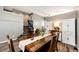 Dining room featuring a wooden table with seating for six and hardwood floors at 8930 Apache Plume Dr, Parker, CO 80134