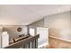 Second story view of the dining room with a decorative table set with seating for six at 8930 Apache Plume Dr, Parker, CO 80134