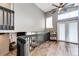 Upstairs loft area featuring a ceiling fan, railing, and hardwood floors at 8930 Apache Plume Dr, Parker, CO 80134