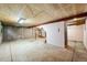 Unfinished basement with exposed ceiling and concrete walls at 11098 Fairfax Way, Thornton, CO 80233