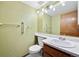 Powder room with green paint and a light countertop at 11098 Fairfax Way, Thornton, CO 80233