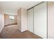 Bedroom with wall-to-wall carpet and closet with sliding doors at 11098 Fairfax Way, Thornton, CO 80233