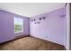 A compact bedroom featuring purple walls and window at 11098 Fairfax Way, Thornton, CO 80233