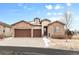 Charming stucco home with a stone facade, attached three car garage, and a well maintained lawn at 49 Willowcroft Dr, Littleton, CO 80123