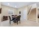 Versatile game room with natural light, adjacent to stairs, and ample space for activities at 49 Willowcroft Dr, Littleton, CO 80123