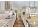 Bright kitchen with stainless steel appliances, granite countertops, and hardwood floors at 49 Willowcroft Dr, Littleton, CO 80123