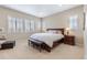 Well-lit main bedroom with shuttered windows, wood furniture, and comfortable seating at 49 Willowcroft Dr, Littleton, CO 80123