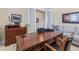 Home office area featuring a large desk with drawers and a comfortable gray sofa at 49 Willowcroft Dr, Littleton, CO 80123