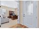 Office space with a wooden desk and cabinetry viewed from a doorway with a glass pane at 49 Willowcroft Dr, Littleton, CO 80123