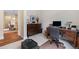 Well-appointed office space with hardwood floors visible in the nearby dining room at 49 Willowcroft Dr, Littleton, CO 80123