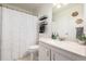 Well-lit bathroom with a shower-tub combination and a sleek granite countertop at 7205 S Gaylord St # F15, Littleton, CO 80122