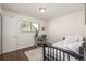 Cozy bedroom with a window view and a decorative rug. Modern desk in the corner at 7205 S Gaylord St # F15, Littleton, CO 80122