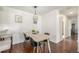 Bright dining room features modern decor, a stylish light fixture, and wood flooring at 7205 S Gaylord St # F15, Littleton, CO 80122