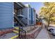 This exterior of the home features a multi-Gathering residence with stairs leading to the upper level at 7205 S Gaylord St # F15, Littleton, CO 80122