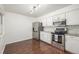 Bright kitchen features stainless steel appliances and ample counter space for cooking at 7205 S Gaylord St # F15, Littleton, CO 80122