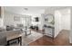 Sunlit living room featuring hardwood floors, stylish decor, modern furniture, and access to the outdoors at 7205 S Gaylord St # F15, Littleton, CO 80122