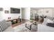 Bright living room with wood floors, comfortable seating, a decorative rug, and a modern entertainment center at 7205 S Gaylord St # F15, Littleton, CO 80122