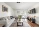 Inviting living room featuring modern decor, neutral tones, and natural light at 7205 S Gaylord St # F15, Littleton, CO 80122