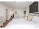 Cozy main bedroom featuring a comfortable bed, modern decor, and ample closet space at 7205 S Gaylord St # F15, Littleton, CO 80122