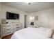 Comfortable main bedroom with dresser, TV, and closet access for a relaxed atmosphere at 7205 S Gaylord St # F15, Littleton, CO 80122