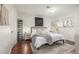Stylish main bedroom with a plush rug, comfortable bed, and closet space at 7205 S Gaylord St # F15, Littleton, CO 80122