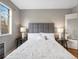 Bedroom features a large window, hardwood floors, and modern furnishings at 1130 N N Pennsylvania St # 306, Denver, CO 80203
