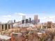 A sprawling city landscape shows the buildings of Denver against a bright blue sky with scattered clouds at 1130 N N Pennsylvania St # 306, Denver, CO 80203
