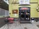 The entrance to Roostercat showcases a set of glass doors and decorative metal art at 1130 N N Pennsylvania St # 306, Denver, CO 80203