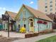 A charming blue and yellow building with Cuba Cuba Cafe signage for the Cuban restaurant at 1130 N N Pennsylvania St # 306, Denver, CO 80203