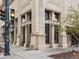 The exterior of Metropolis Coffee is shown with large stone pillars and Metropolis Coffee signage at 1130 N N Pennsylvania St # 306, Denver, CO 80203