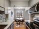 Updated kitchen view towards breakfast nook with a hardwood floor at 1130 N N Pennsylvania St # 306, Denver, CO 80203