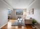 Inviting living room featuring hardwood floors, large window, and comfortable seating at 1130 N N Pennsylvania St # 306, Denver, CO 80203