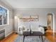 Bright living room with hardwood floors, modern furniture, and ample natural light at 1130 N N Pennsylvania St # 306, Denver, CO 80203