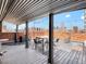 Covered roof deck offering city views, a brick surround, and shaded outdoor space at 1130 N N Pennsylvania St # 306, Denver, CO 80203