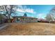 Large backyard featuring a patio, ample green space, and a fence, offering privacy and room for outdoor enjoyment at 7248 S Broadway, Centennial, CO 80122
