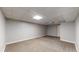 Spacious finished basement with neutral carpet and ample room for activities at 7248 S Broadway, Centennial, CO 80122