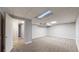 Neutral finished basement with access to a utility room, offering storage space at 7248 S Broadway, Centennial, CO 80122