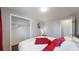 Bright bedroom with hardwood floors, comfortable bed with stylish linens, and ample closet space at 7248 S Broadway, Centennial, CO 80122