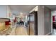 Bright kitchen with stainless steel appliances that opens to dining room at 7248 S Broadway, Centennial, CO 80122