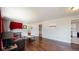 The living room has rich hardwood floors, neutral paint, and a comfortable seating arrangement centered around a coffee table at 7248 S Broadway, Centennial, CO 80122