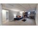 Cozy living room with stone fireplace, plush carpet, and neutral-toned decor, perfect for relaxation and entertaining at 7248 S Broadway, Centennial, CO 80122