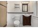 Bathroom with toilet, vanity, and black and white tile floor at 1944 W 33Rd Ave, Denver, CO 80211