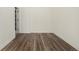 Bright bedroom with wood-look floors and access to another room at 1944 W 33Rd Ave, Denver, CO 80211