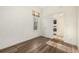 Bedroom with wood-look floors and kitchen access at 1944 W 33Rd Ave, Denver, CO 80211