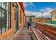 Wooden deck with bench, brick building and grill at 1944 W 33Rd Ave, Denver, CO 80211