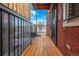 Small wooden deck with exterior door and railing at 1944 W 33Rd Ave, Denver, CO 80211